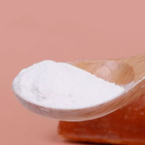 Sodium octanoate Wooden spoon holding a mound of white powder against a peach background (likely baking soda).