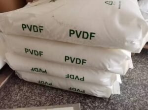Stack of white bags with PVDF printed in green on a speckled floor.